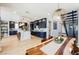 Open-concept kitchen with navy cabinets, a large island, and modern lighting at 2750 Evolutionary Ln, Las Vegas, NV 89138