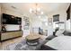 Inviting living area with a cozy sofa, unique lighting fixture, and stylish decor at 2750 Evolutionary Ln, Las Vegas, NV 89138