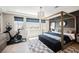 Serene main bedroom featuring a canopy bed, modern decor, and scenic views at 2750 Evolutionary Ln, Las Vegas, NV 89138