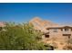 Scenic mountain view overlooking residential homes and lush greenery under a clear blue sky at 2750 Evolutionary Ln, Las Vegas, NV 89138