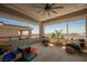 Covered patio with comfortable seating and a scenic view, perfect for relaxation at 2750 Evolutionary Ln, Las Vegas, NV 89138