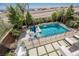 Aerial view of a refreshing pool and spa surrounded by well-manicured landscaping at 2750 Evolutionary Ln, Las Vegas, NV 89138