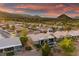 Views of house with pool, landscaped grounds, and stunning mountain backdrop within a desert community in Nevada at 2820 High Range Dr, Las Vegas, NV 89134