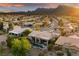 Views of a house with pool and patio, mountain views, and the surrounding desert landscape in Nevada at 2820 High Range Dr, Las Vegas, NV 89134