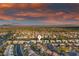 Panoramic aerial view of neighborhood with sunset, highlighting the prime location and community feel at 2820 High Range Dr, Las Vegas, NV 89134
