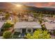 Home's rear view features a pool and patio area, complemented by mountain views in a desert-style neighborhood at 2820 High Range Dr, Las Vegas, NV 89134