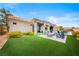Expansive backyard with manicured lawn and relaxing outdoor seating at 2820 High Range Dr, Las Vegas, NV 89134