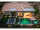 Aerial view of backyard with a sparkling pool, spa, outdoor kitchen, and inviting patio area for entertainment at 2820 High Range Dr, Las Vegas, NV 89134