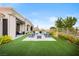 Beautifully landscaped backyard featuring a cozy fire pit area at 2820 High Range Dr, Las Vegas, NV 89134