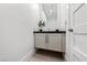 Neutral-toned powder room with a vessel sink, sleek vanity, and clean design at 2820 High Range Dr, Las Vegas, NV 89134