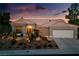 Charming single-story home boasts a well-manicured front yard, desert landscaping, and a warm, inviting ambiance at 2820 High Range Dr, Las Vegas, NV 89134