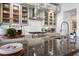 Stylish kitchen with marble backsplash, stainless steel appliances, and modern fixtures, perfect for cooking at 2820 High Range Dr, Las Vegas, NV 89134