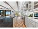 Well-equipped kitchen featuring marble countertops, stainless steel appliances, and an adjacent dining area with outdoor views at 2820 High Range Dr, Las Vegas, NV 89134