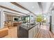 Open concept kitchen and living room with large center island, modern appliances, and seamless flow to the living area at 2820 High Range Dr, Las Vegas, NV 89134
