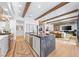 Spacious kitchen with stainless appliances, marble island and open to the living area at 2820 High Range Dr, Las Vegas, NV 89134
