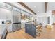 Stylish kitchen with stainless appliances, large island, and modern gray cabinetry at 2820 High Range Dr, Las Vegas, NV 89134
