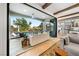 Living room with indoor-outdoor flow to patio and pool at 2820 High Range Dr, Las Vegas, NV 89134
