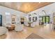 Bright living room with wood floors, modern furniture, and seamless flow to outdoor pool and entertaining areas at 2820 High Range Dr, Las Vegas, NV 89134