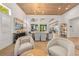 Spacious living room with high ceilings, modern lighting, and an open layout with a dining table at 2820 High Range Dr, Las Vegas, NV 89134