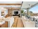 Stylish living room showcasing built-in shelving, fireplace, expansive sliding doors to integrate indoor/outdoor living at 2820 High Range Dr, Las Vegas, NV 89134