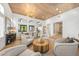 Bright living room featuring vaulted ceilings, wood floors, an open floorplan and ample seating at 2820 High Range Dr, Las Vegas, NV 89134