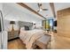 Stylish main bedroom suite featuring beamed ceilings and a sitting area with outdoor views at 2820 High Range Dr, Las Vegas, NV 89134