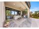 Covered patio featuring comfortable seating and an outdoor kitchen area at 2820 High Range Dr, Las Vegas, NV 89134
