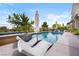 Relaxing pool and spa with stylish lounge chairs and beautiful landscaping at 2820 High Range Dr, Las Vegas, NV 89134