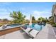 Relaxing backyard showcasing a refreshing pool, spa, and lounge chairs for ultimate outdoor enjoyment at 2820 High Range Dr, Las Vegas, NV 89134