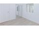 Bright bedroom with closet, white walls, and wood-look flooring at 3008 Lawndale St, Las Vegas, NV 89121