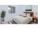 Cozy bedroom bathed in natural light, decorated with plants and contemporary artwork at 3008 Lawndale St, Las Vegas, NV 89121