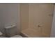 The bathroom features a toilet and a bathtub with light beige wall panels at 3101 E Carey Ave, North Las Vegas, NV 89030