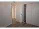 Bedroom featuring new laminate flooring, fresh paint and closet with sliding doors at 3101 E Carey Ave, North Las Vegas, NV 89030