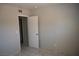 The bedroom has neutral walls, tile flooring, and an open door at 3101 E Carey Ave, North Las Vegas, NV 89030