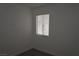 This bedroom features wood-look floors and a window with blinds at 3101 E Carey Ave, North Las Vegas, NV 89030