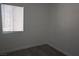 This bedroom features a window with blinds and base trim at 3101 E Carey Ave, North Las Vegas, NV 89030