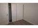 Bedroom showing closet with sliding doors, new laminate flooring and fresh paint at 3101 E Carey Ave, North Las Vegas, NV 89030