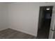 This bedroom features base trim and an entry door at 3101 E Carey Ave, North Las Vegas, NV 89030