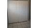 View of a closet with white bi-fold doors and tile floors at 3101 E Carey Ave, North Las Vegas, NV 89030