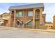 Side view of a two-story building showcasing a unique architectural design and exterior staircase at 3101 E Carey Ave, North Las Vegas, NV 89030