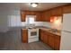 Well-lit kitchen with wood cabinets, modern appliances, and durable countertops at 3101 E Carey Ave, North Las Vegas, NV 89030