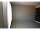 This living room features tile flooring and a sliding glass door at 3101 E Carey Ave, North Las Vegas, NV 89030