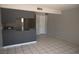 This living room features tile flooring and an open kitchen at 3101 E Carey Ave, North Las Vegas, NV 89030