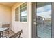 View of a private covered patio area with seating at 3159 Via Como, Henderson, NV 89044