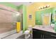 Bright bathroom with a shower-tub combination and black vanity at 3159 Via Como, Henderson, NV 89044