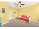 Cozy bedroom features a ceiling fan, a comfortable daybed, and neutral carpeting at 3159 Via Como, Henderson, NV 89044