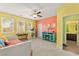 Bright bedroom with cheerful colors, a ceiling fan, and a view of the exterior at 3159 Via Como, Henderson, NV 89044