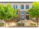 Modern townhouse featuring a charming exterior with a balcony and manicured landscaping at 3159 Via Como, Henderson, NV 89044