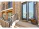 Charming front entrance featuring a brick facade, modern railing, and a welcoming vibe at 3159 Via Como, Henderson, NV 89044