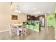 Eat-in kitchen featuring modern bar seating and stainless appliances at 3159 Via Como, Henderson, NV 89044